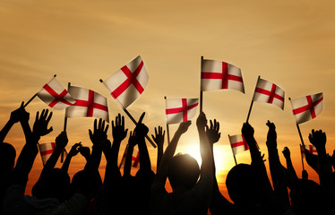 Silhouettes of People Holding Flag of England