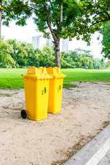 trash can yellow in park