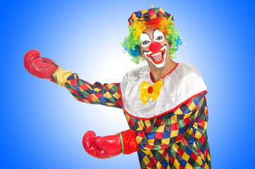 Clown with boxing gloves isolated on white