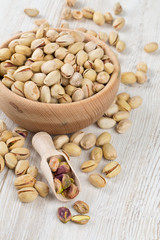 pistachios on wooden surface
