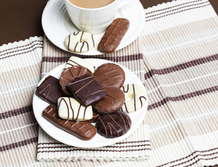 cup of coffee with chocolate biscuits