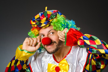 Funny clown in colourful costume