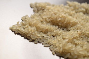 Raw rice on a brown plate