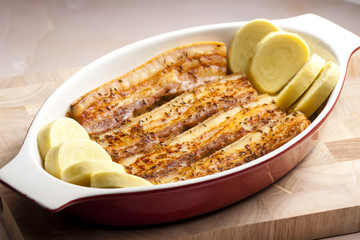 baked pork belly on cumin with potato dumlings
