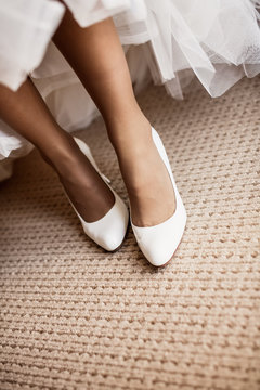 Bride in wedding shoes