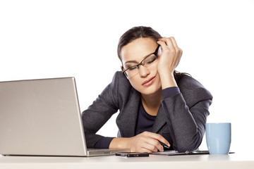 very tired business woman fell asleep leaning on her hand - obrazy, fototapety, plakaty