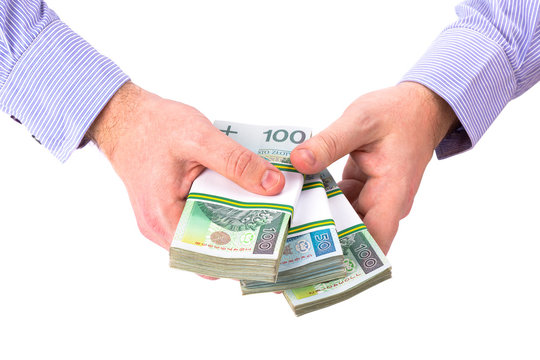 Cash in hand as a loan symbol over white background