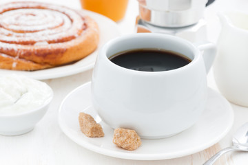 black coffee, sweet bun and cream