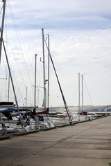 catamarans and yachts in the harbor at the pier