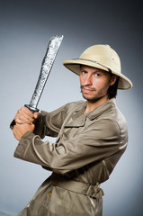 Funny safari hunter against background