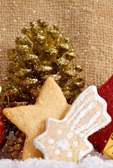 Christmas cookies and decoration isolated on brown background. 