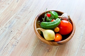 Fresh vegetables in wooden bowl