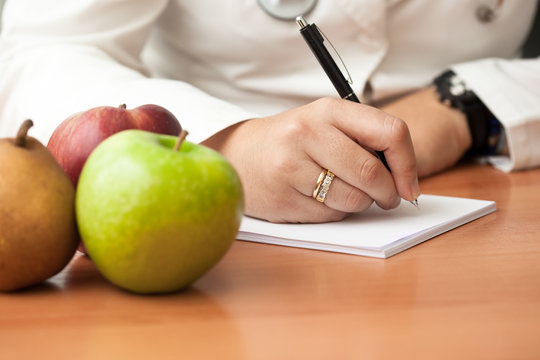 Nutrionist doctor writing