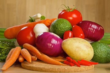 Bunch of fresh vegetables on a wooden board