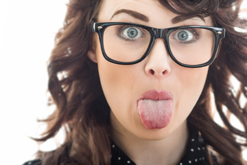 Close up woman sticking her tongue out