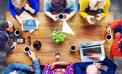 Group of Business People Discussing on a Cafe