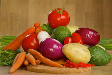 Bunch of fresh vegetables on a wooden board