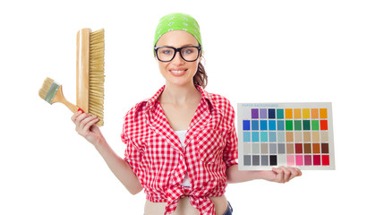 Woman holding paintbrush and color samples