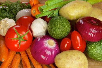 Different vegetables lying on a wooden table