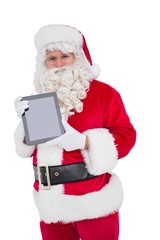 Happy santa showing digital tablet