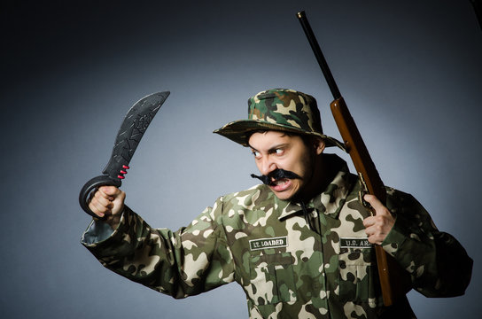 Funny soldier in military concept