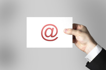 hand holding white card mail at symbol