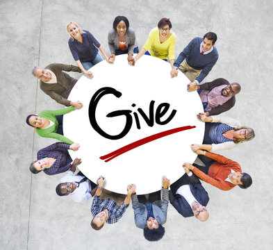 Group of People Holding Hands Around the Word Give