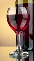 bottle and a glass of wine