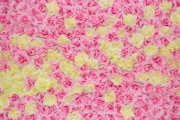 Huge pink and yellow roses floral bouquet background