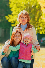 Grandmother with adult daughter and grandchild