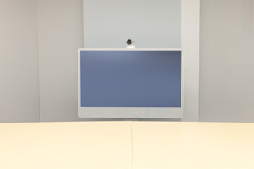 Video Conference room with one screen in front of meeting table