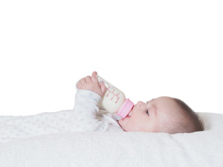 Baby boy  drinking milk from the bottle isolated