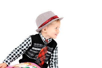 Smiling happy boy in hat shot in the studio on a white backgroun