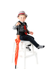 Boy with umbrella studio shot isolated on a white background