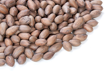 Obraz premium Stack of Unshelled Pecan Nuts with Copy Space