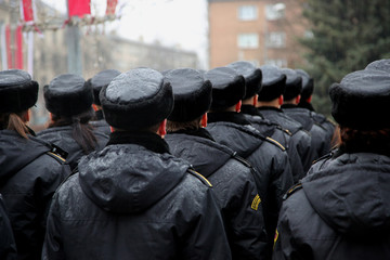 The police person on the parade in the uniform
