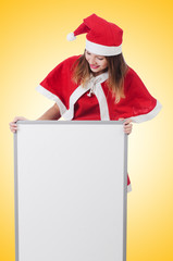 Young woman in red santa costume on white