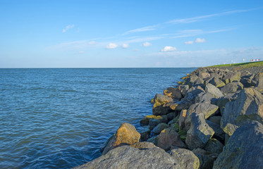 Protecting basalt stones along a sea at fall