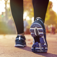 Fitness Girl running at sunset