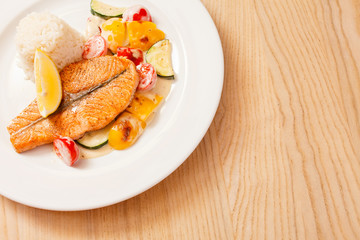 fish steak wit rice and vegetables