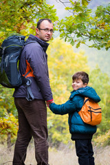 Fototapeta na wymiar Autumn family hiking