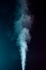 Blue vapor on the black background
