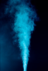 Blue vapor on the black background