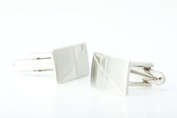 Cufflinks on white background