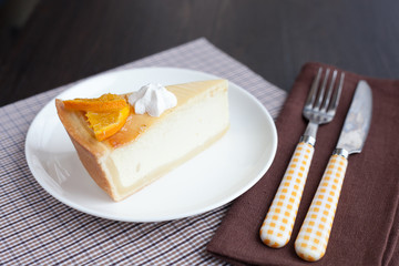 Cheesecake Dessert decorated with oranges and meringue