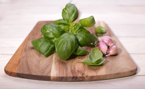 Different fresh herbs on wooden background, parsley and basil