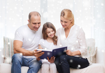 happy family with book at home