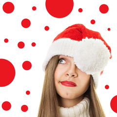 Cute teenage girl with Christmas hat looking up
