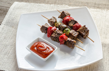 Grilled beef skewers with pepper and brussels