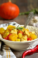 Pumpkin stewed with chicken and rosemary.